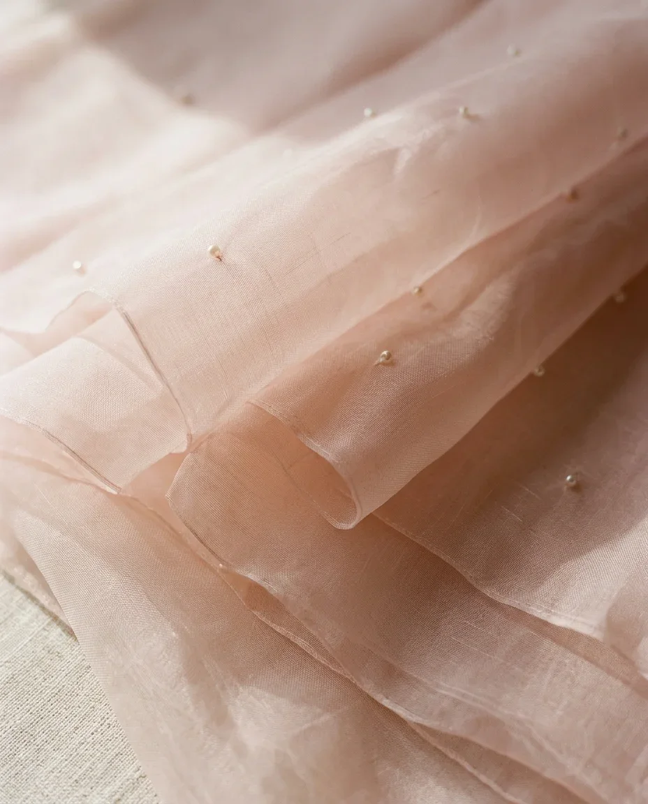 Blush organza saree — the cloth, close up